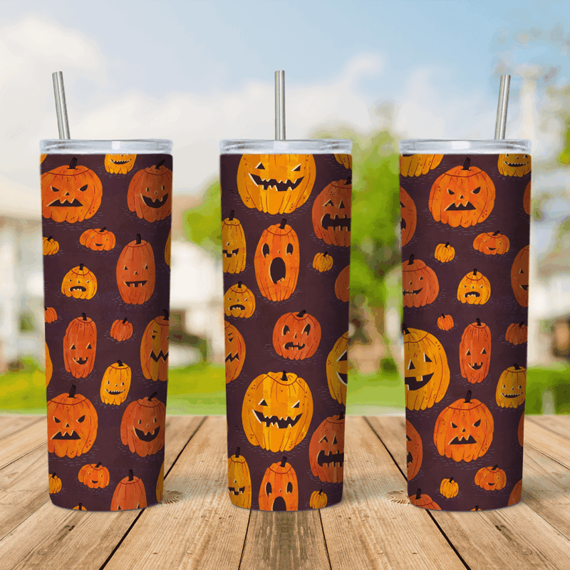 A full 20 oz skinny tumbler wrap with a repeating pattern of orange jack o lanterns with different carved faces on a dark brown. Sublimation design