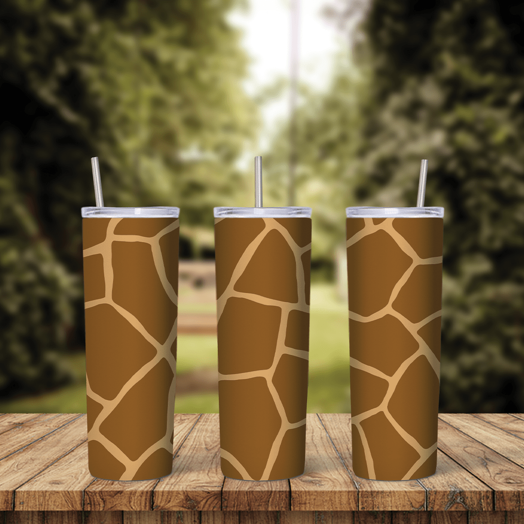 A full 20 oz skinny tumbler wrap with a giraffe print pattern: tan and brown patches separated by light cream lines. Sublimation design