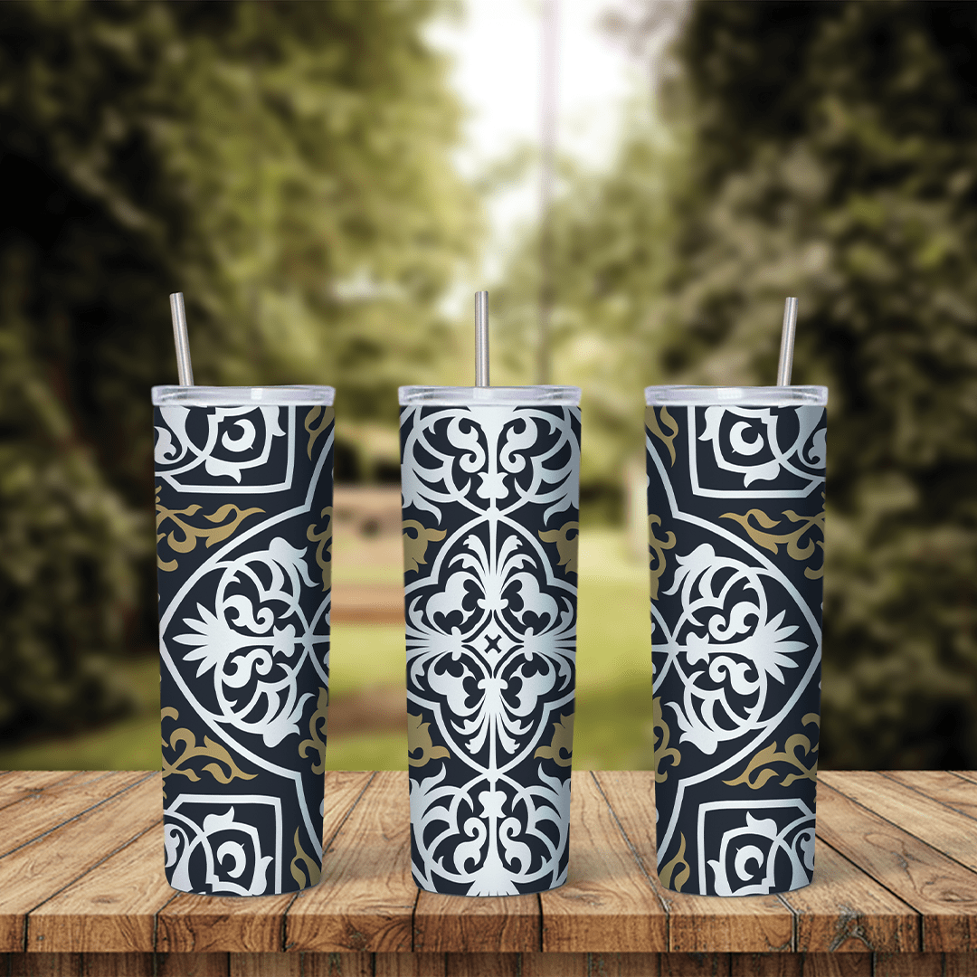A 20 oz skinny tumbler wrap with a black and white arabesque tile pattern: ornate white medallions with gold scroll accents. Sublimation design