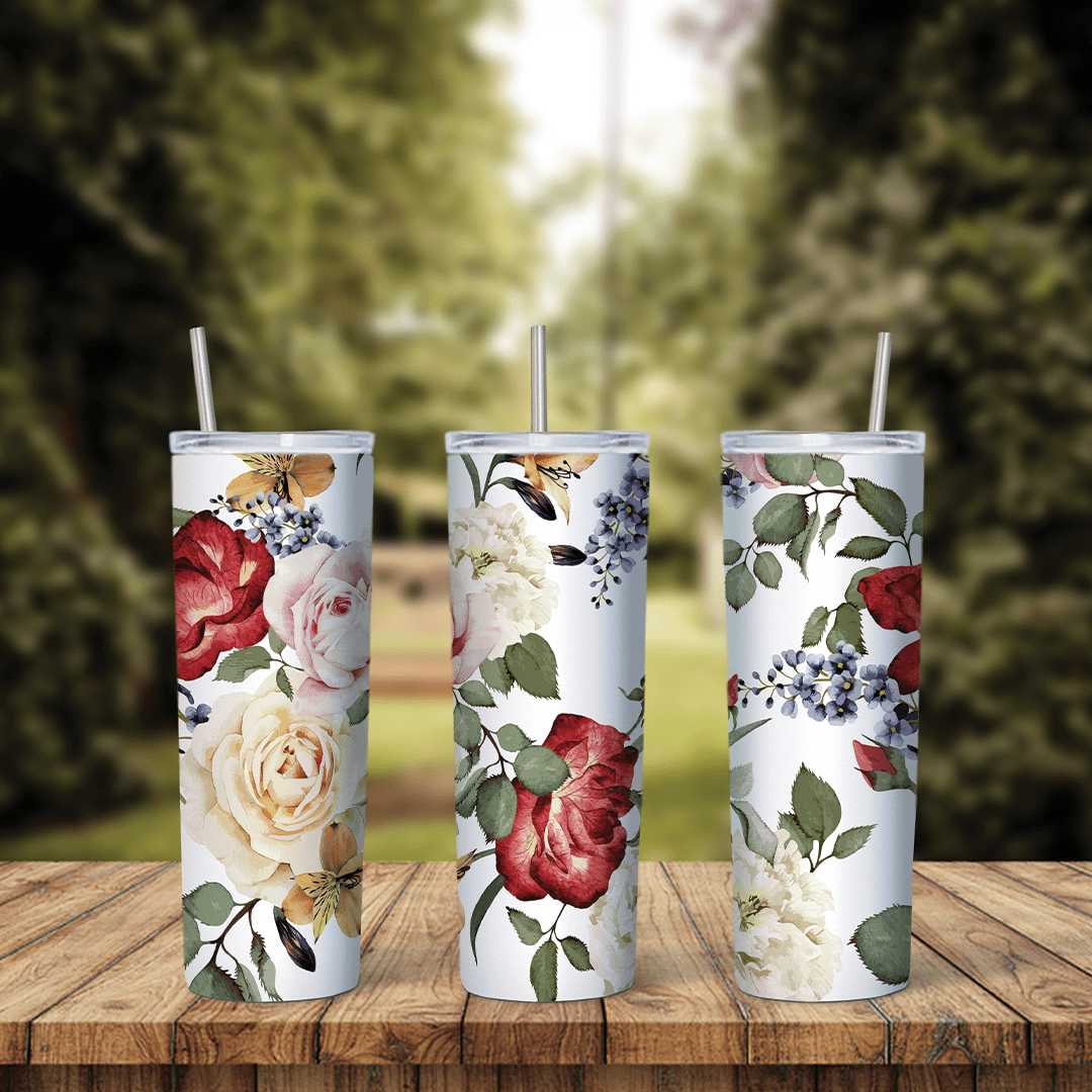 A full 20 oz skinny tumbler wrap with red and cream roses, small blue flowers and green leaves on white. Sublimation design