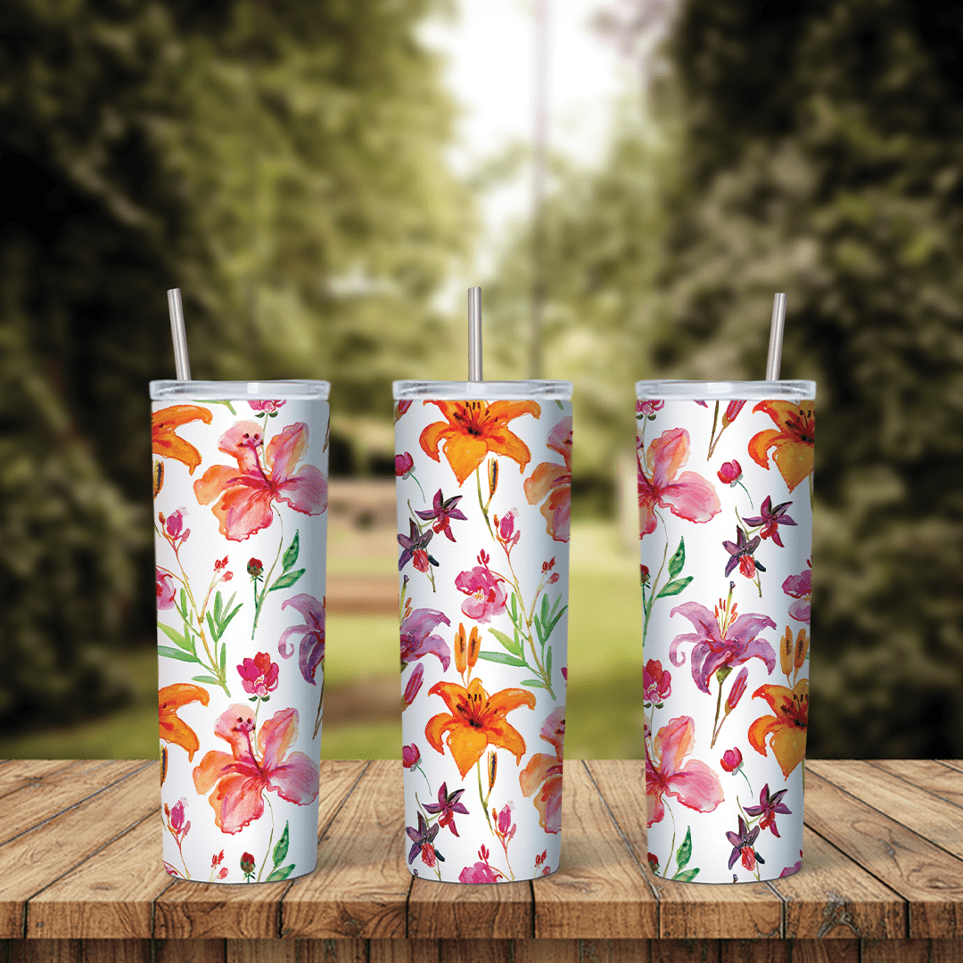 A full 20 oz skinny tumbler wrap with watercolor orange and pink lilies and small leaves on a white background. Sublimation design