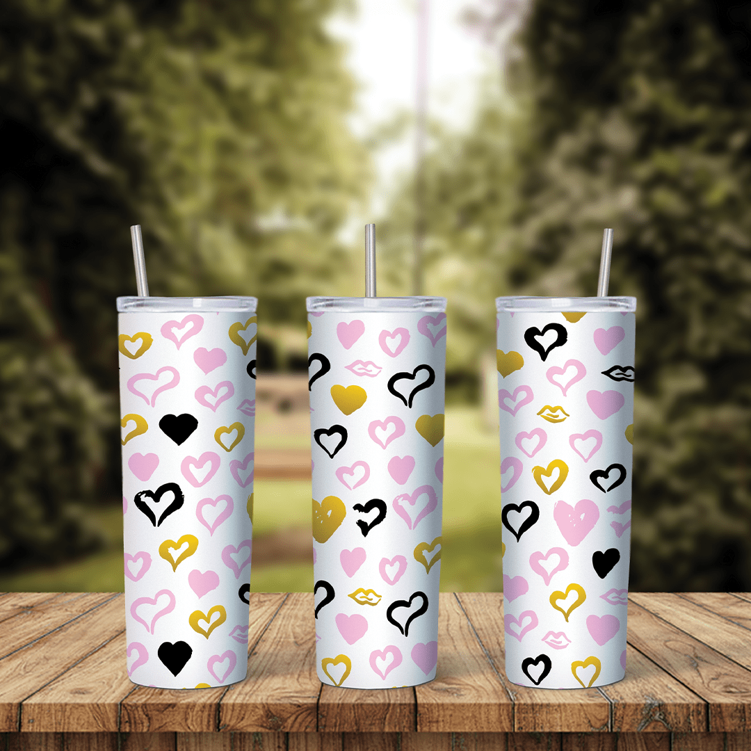 A full 20 oz skinny tumbler wrap with doodle outline hearts in pink, black and gold, with lip prints, scattered over white. Sublimation design