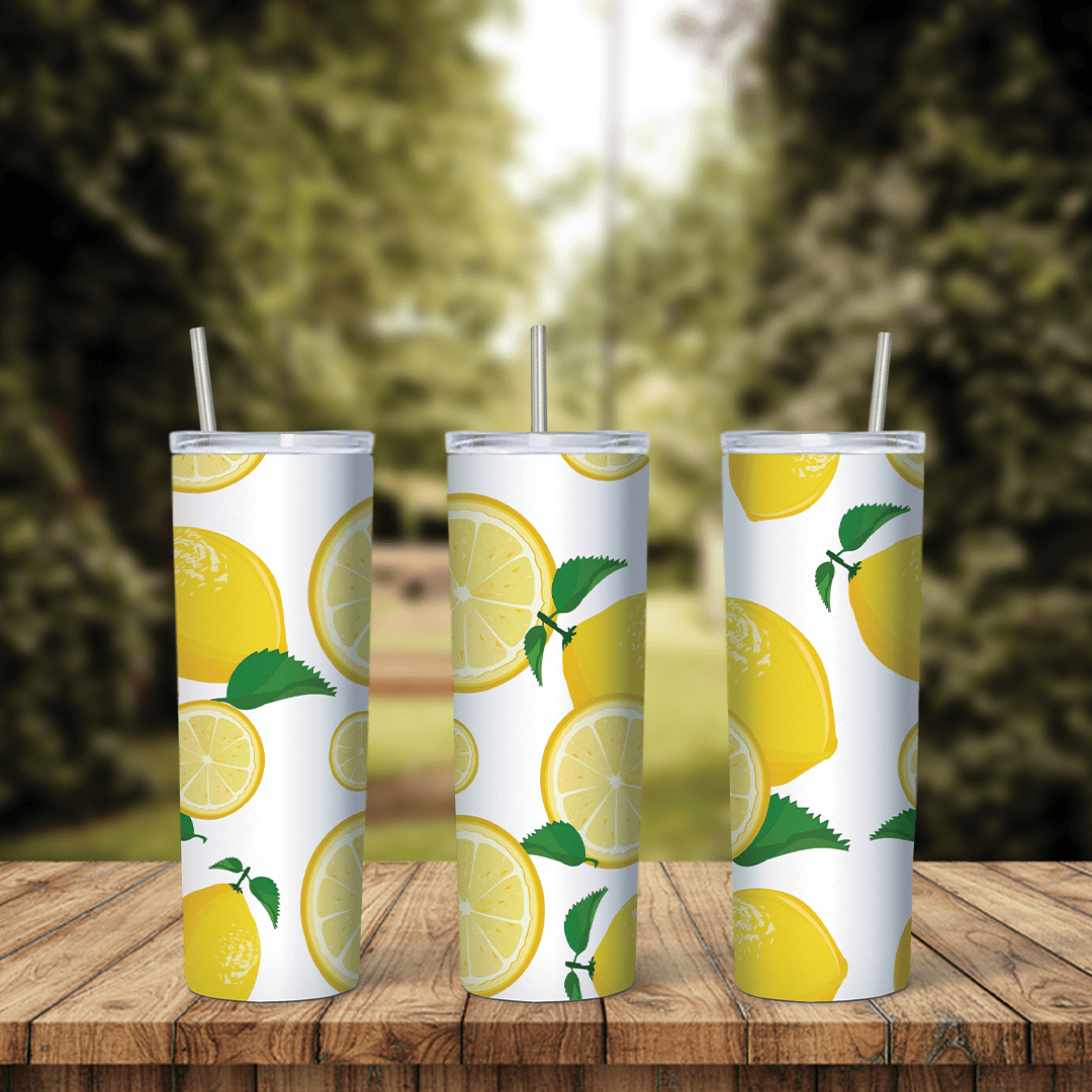 A full 20 oz skinny tumbler wrap with watercolor style whole lemons, lemon halves and green leaves on white. Sublimation design