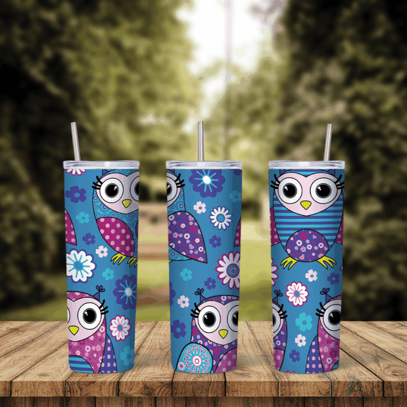 A blue 20 oz tumbler wrap with cartoon owls in pink, purple and blue patchwork patterns, big round eyes and scattered flowers. Sublimation design