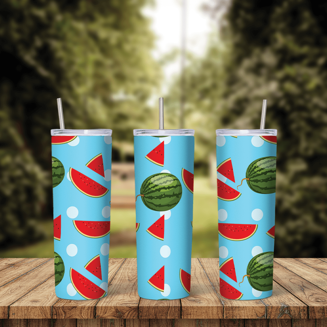 A full 20 oz skinny tumbler wrap with watermelon slices and whole watermelons scattered on light blue with white dots. Sublimation design