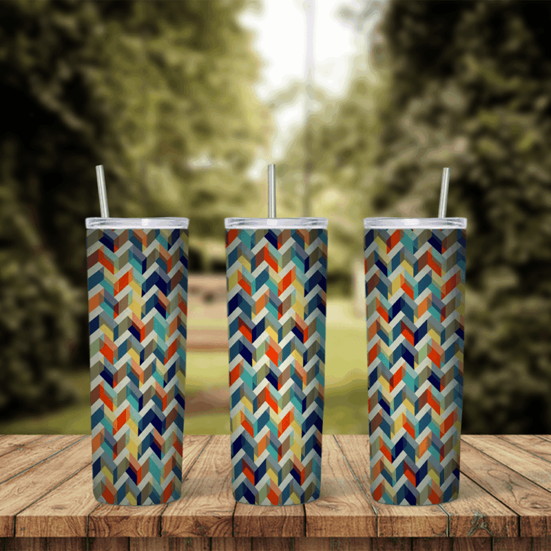 A 20 oz skinny tumbler wrap with a 3D textured herringbone pattern of zigzag stripes in blue, teal, orange, red and cream. Sublimation design