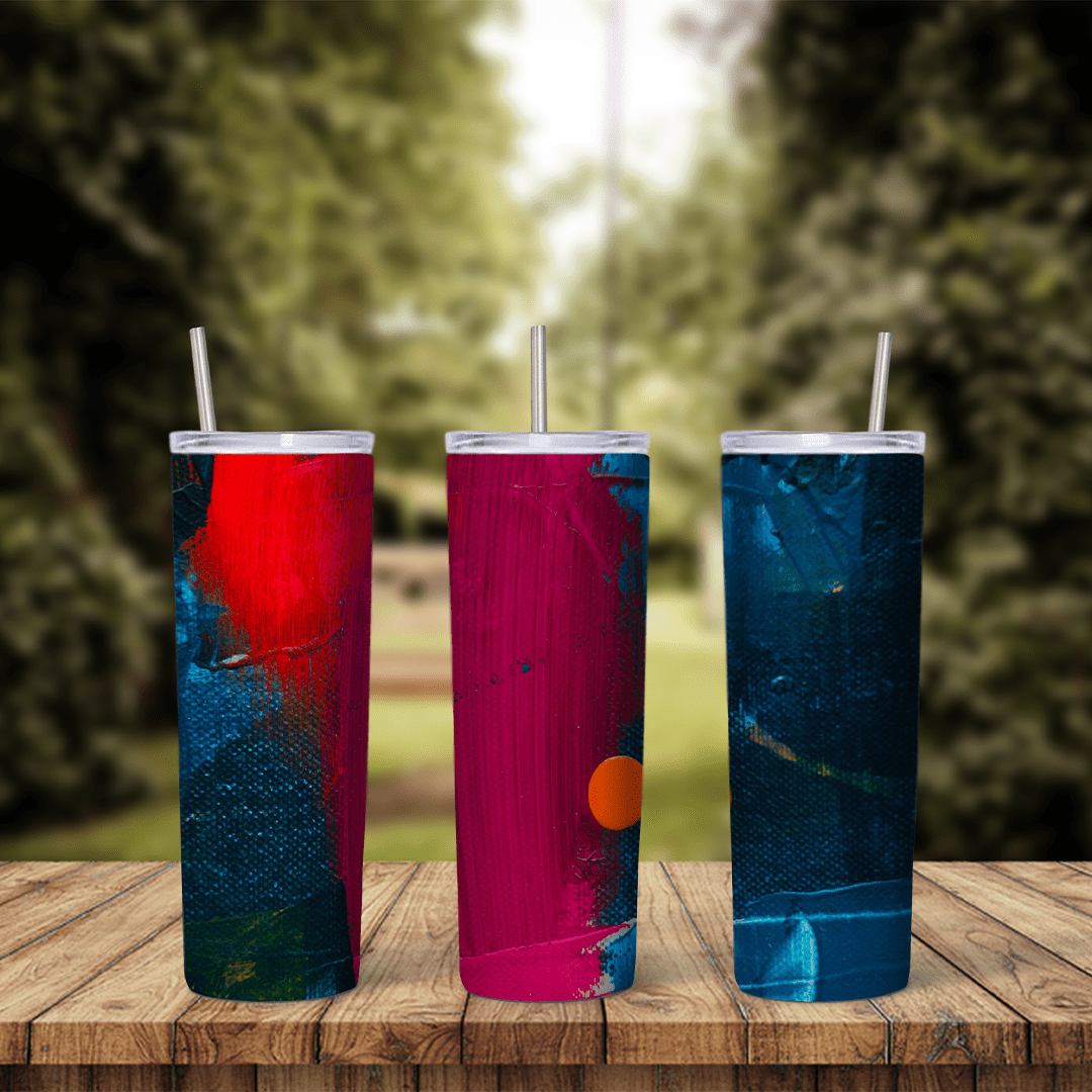 A full 20 oz skinny tumbler wrap with painted blocks of red, magenta and navy blue, with an orange dot and brush texture. Sublimation design