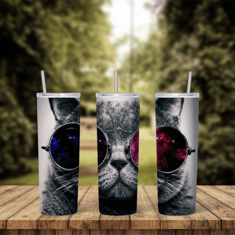 A 20 oz tumbler wrap with a gray tabby cat face wearing round sunglasses that reflect a purple and red galaxy. Sublimation design