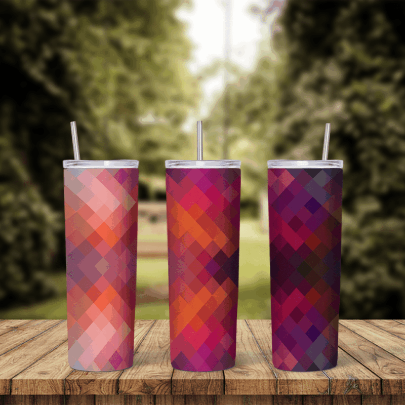 A full 20 oz skinny tumbler wrap with a diamond mosaic pattern in coral, pink, magenta, red and purple. Sublimation design