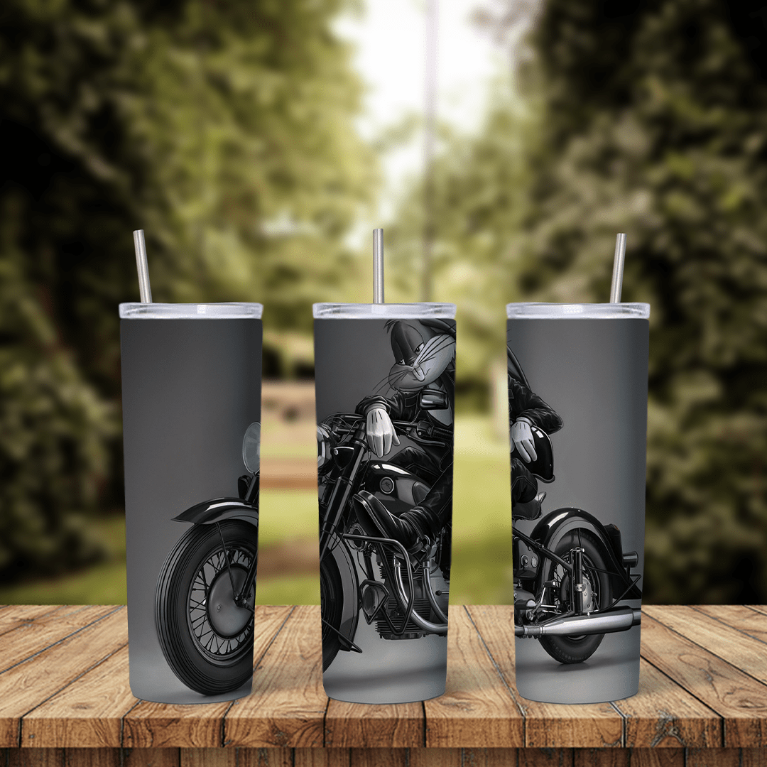 A full 20 oz skinny tumbler wrap in black and white of Bugs Bunny riding a large motorcycle. Sublimation design