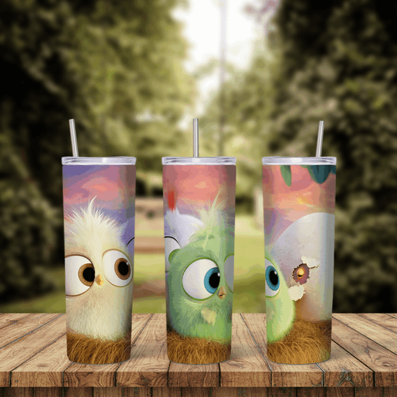 An Angry Birds tumbler wrap with fluffy baby hatchlings in cream, green and blue with big eyes, in front of a soft pastel sky. Sublimation design