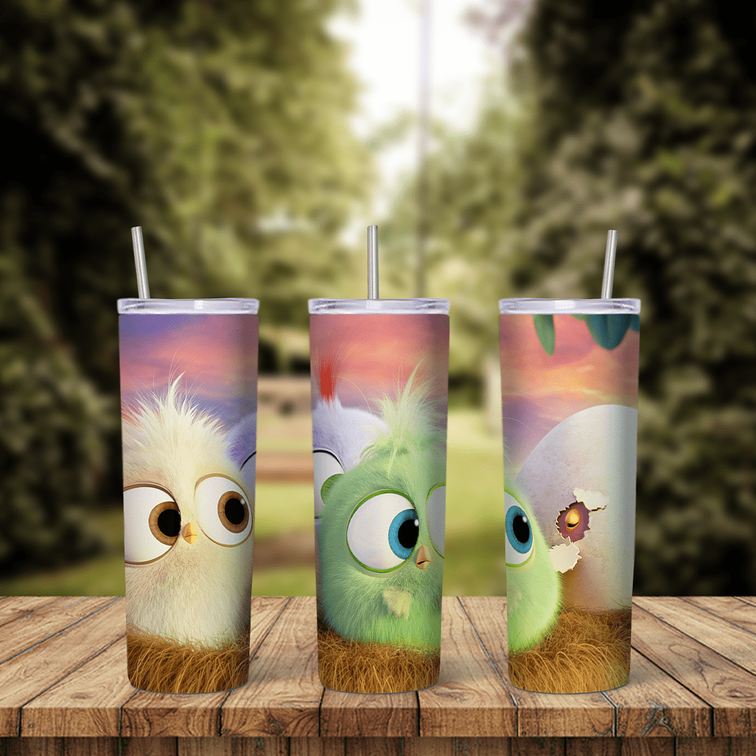 An Angry Birds tumbler wrap with fluffy baby hatchlings in cream, green and blue with big eyes, in front of a soft pastel sky. Sublimation design