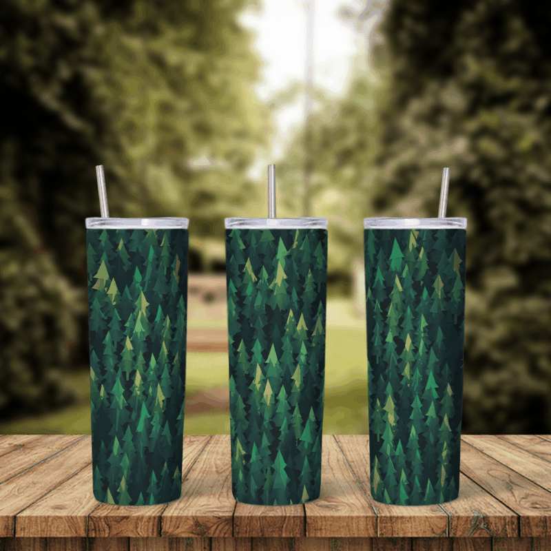 A full 20 oz skinny tumbler wrap covered in a dense pattern of dark green and olive pine trees. Sublimation design