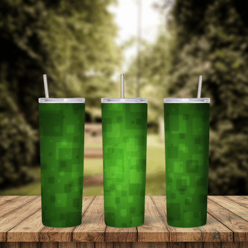 A full 20 oz skinny tumbler wrap in green with a soft pixel pattern of light and dark green squares. Sublimation design