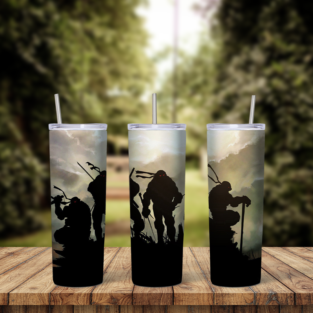 A 20 oz skinny tumbler wrap with black silhouettes of the four ninja turtles and their weapons standing against a misty grey sky. Sublimation design