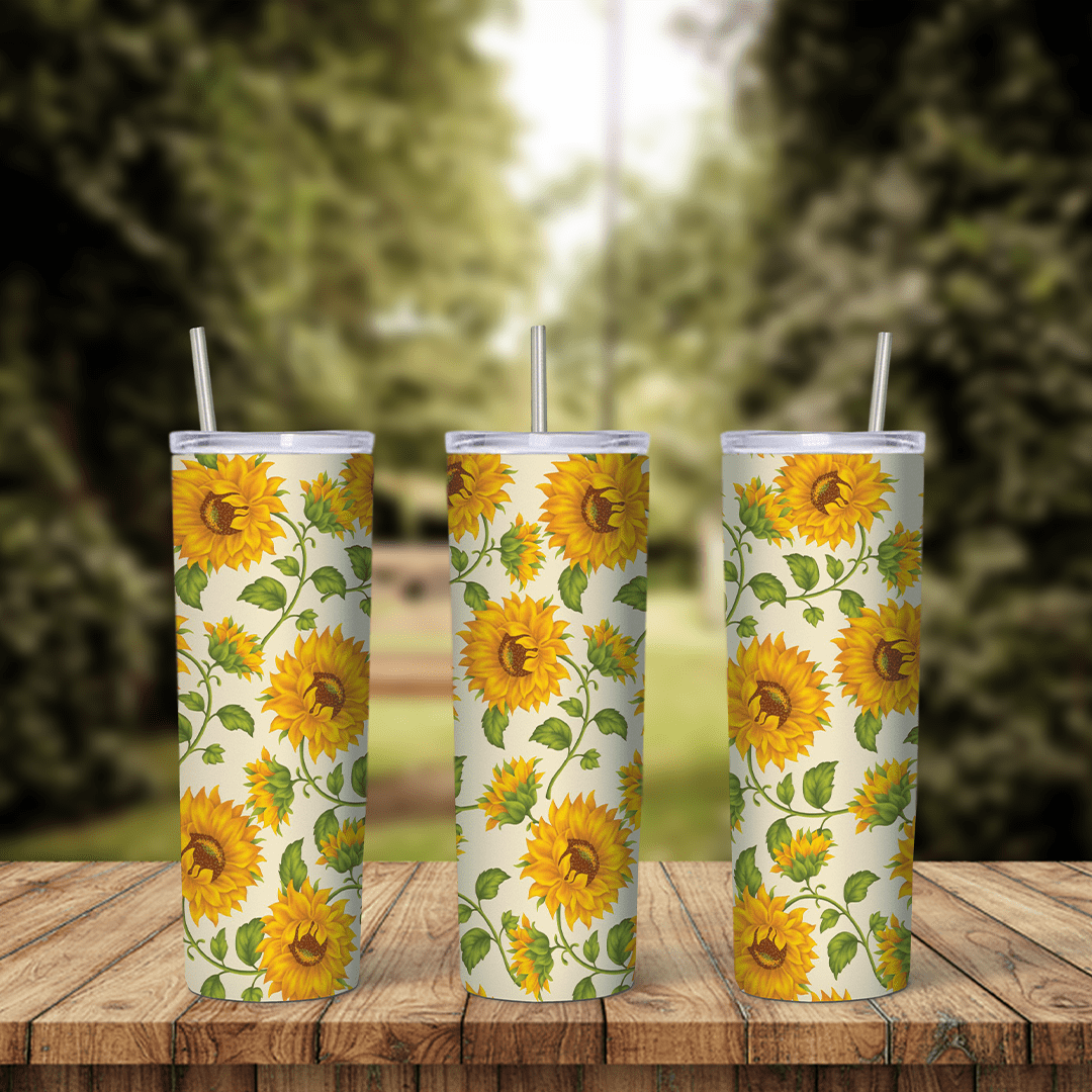 A sunflower tumbler wrap: yellow sunflowers with green leaves and curling vines scattered over a soft cream background. Sublimation design