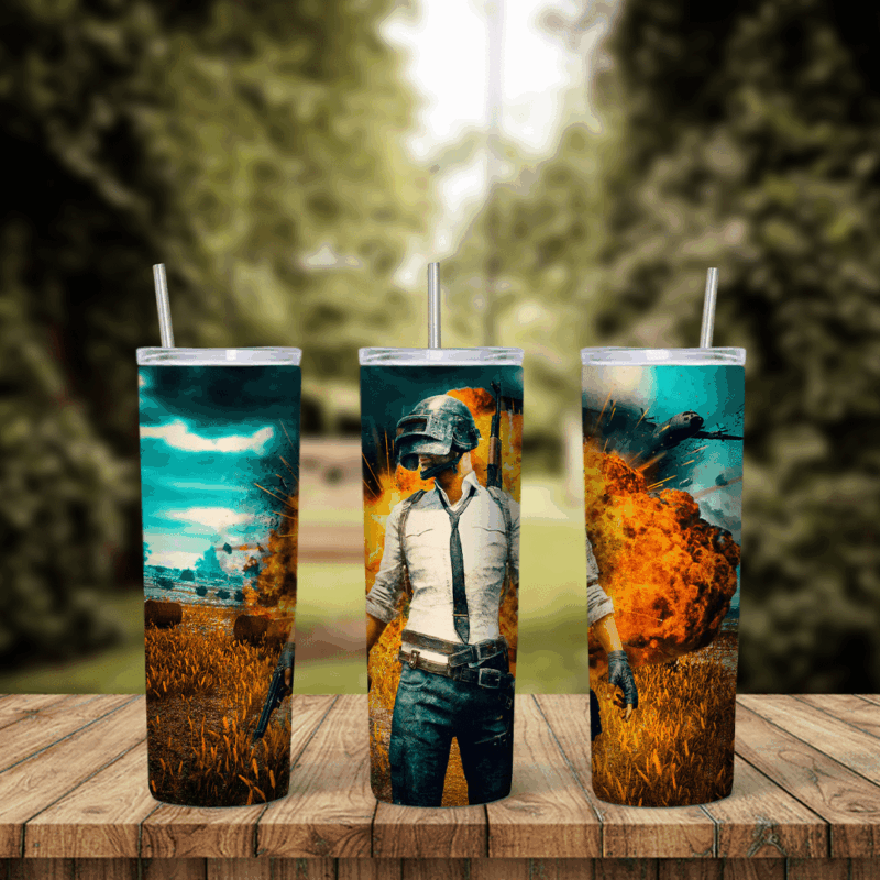 A full 20 oz skinny tumbler wrap with PUBG game art: a player in a helmet and white shirt standing before a fiery explosion. Sublimation design
