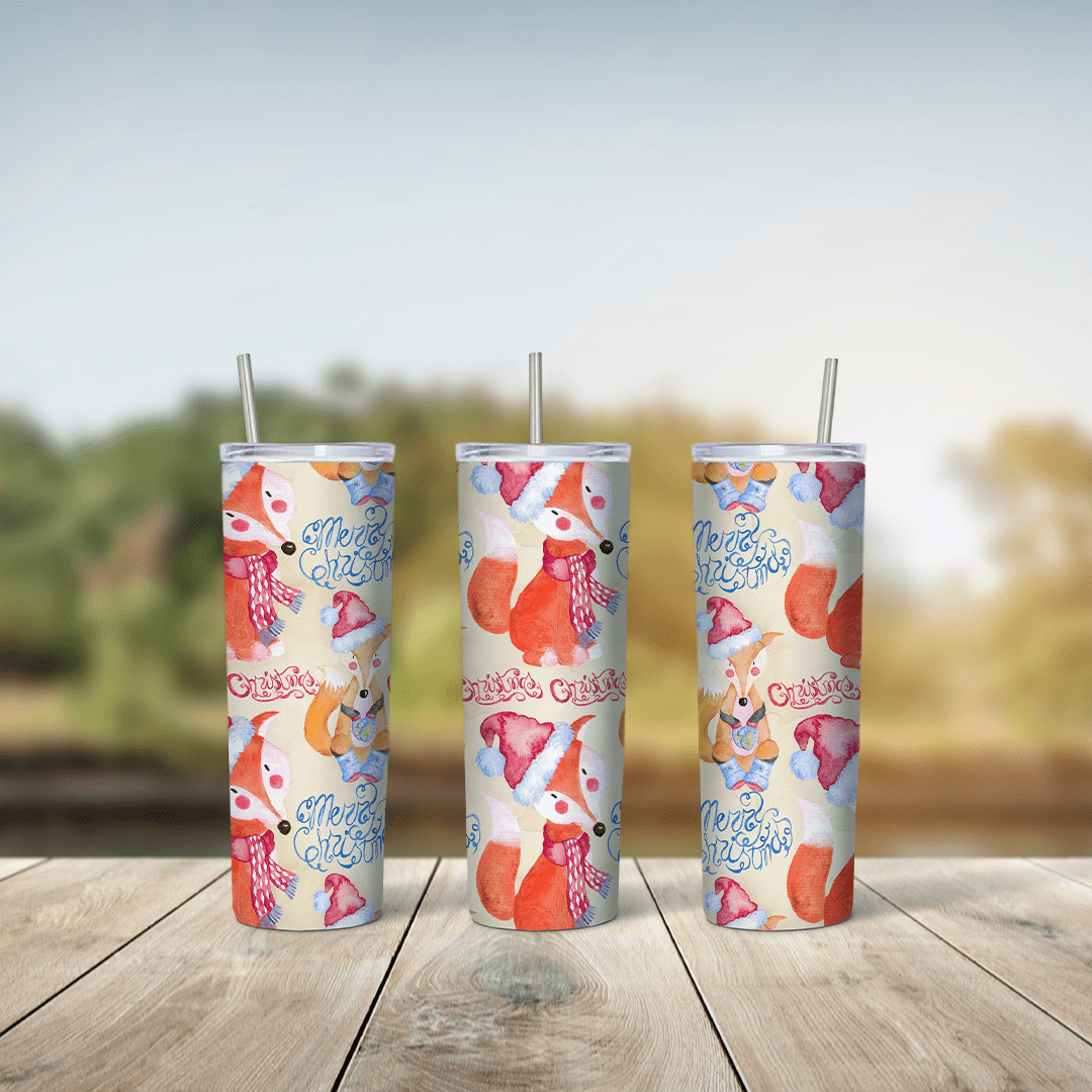 A 20 oz skinny tumbler wrap with cute cartoon orange foxes and small pink and blue details over a pale pastel background. Sublimation design