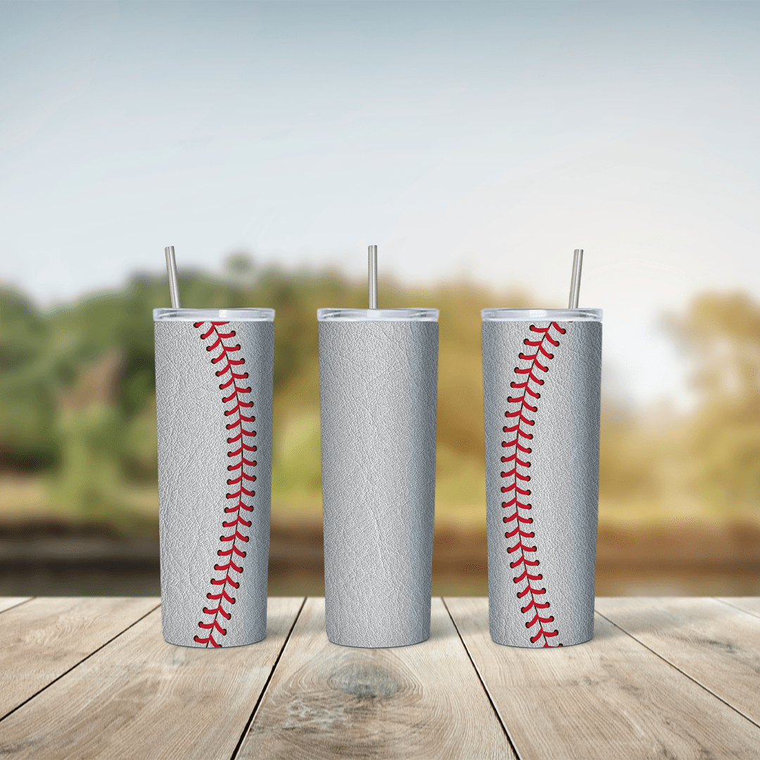 A 20 oz skinny tumbler wrap made to look like a white leather baseball, with curved red stitching running down both sides. Sublimation design