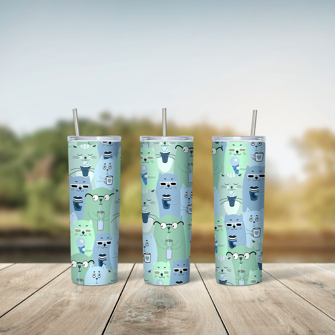 A green and blue 20 oz tumbler wrap with a repeating pattern of small stacked cartoon cats with tiny faces. Sublimation design