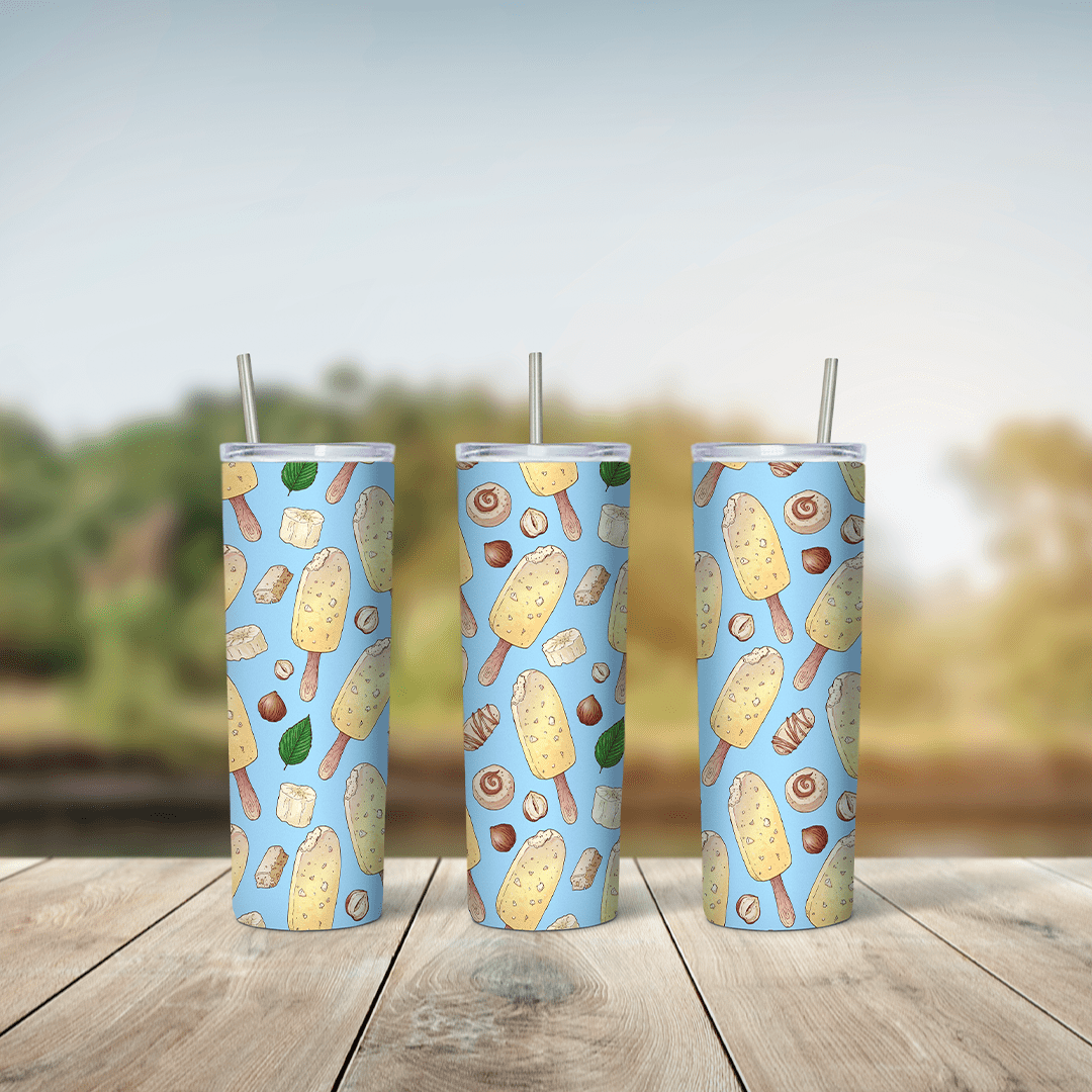 A full 20 oz skinny tumbler wrap with a pattern of vanilla ice cream bars, cones, chocolate truffles and mint leaves on a light. Sublimation design
