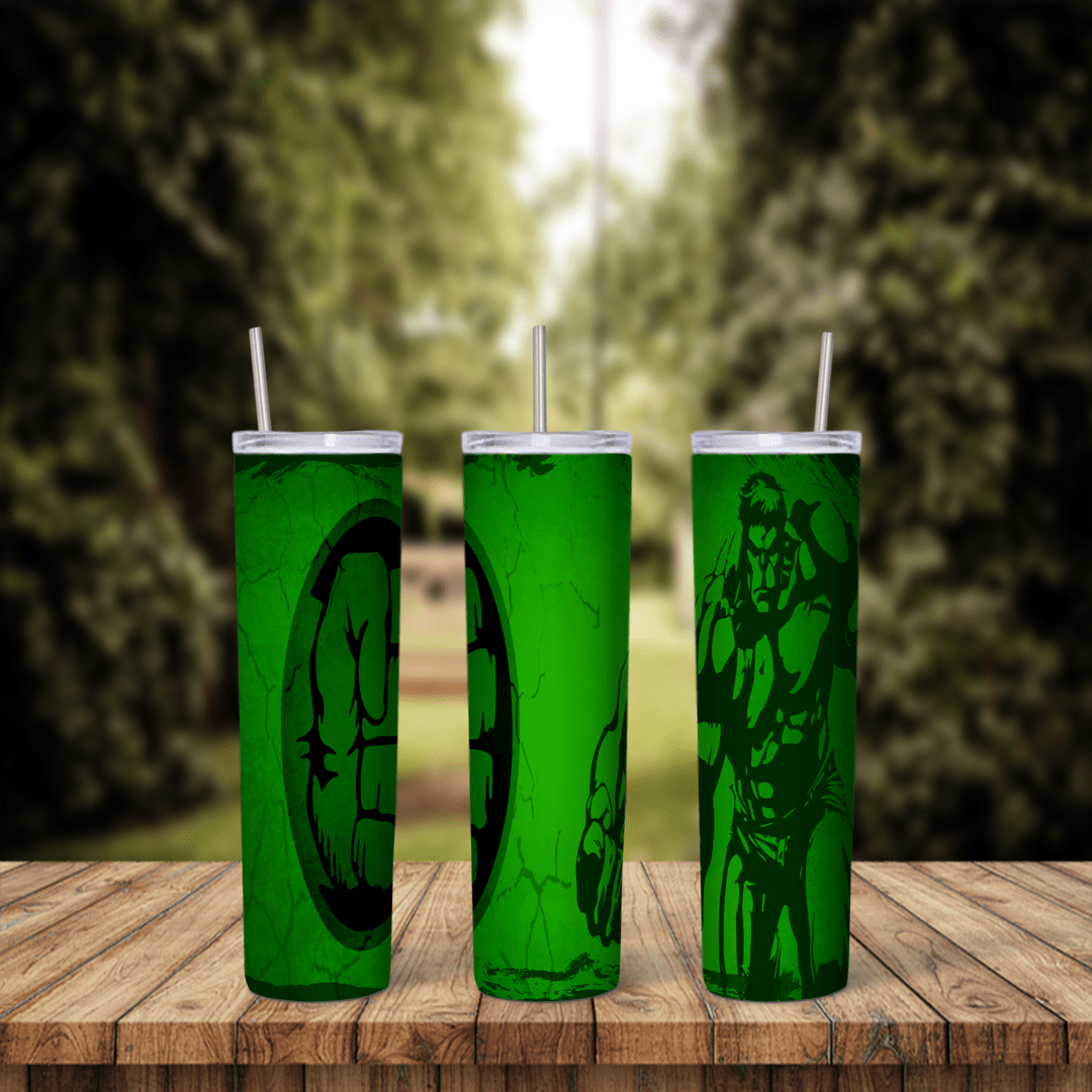 A 20 oz skinny tumbler wrap in cracked green with a dark green Hulk fist logo in a circle and a dark green Hulk figure on the side. Sublimation design