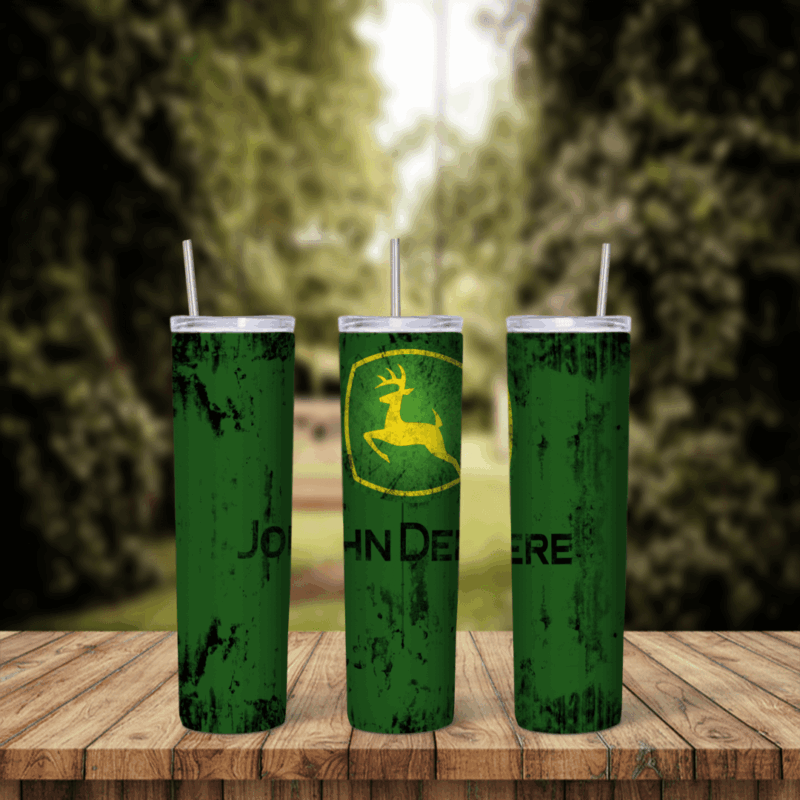 A 20 oz skinny tumbler wrap in green and yellow: the John Deere leaping deer logo and John Deere lettering over a distressed. Sublimation design
