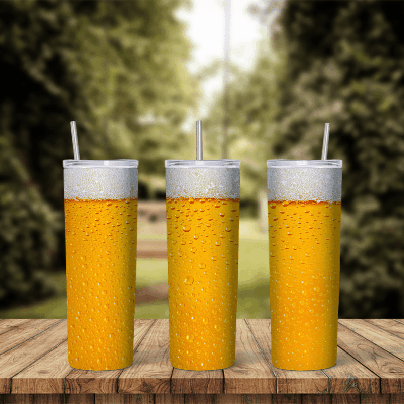 A 20 oz skinny tumbler wrap that looks like a full glass of golden beer, with white foam at the top and condensation drops all. Sublimation design