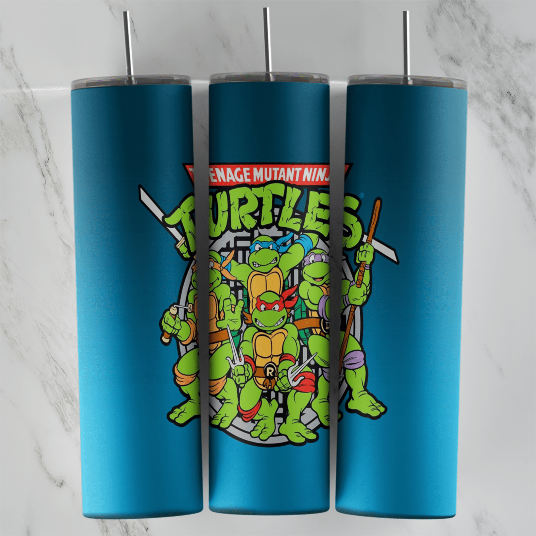 A 20 oz skinny tumbler wrap with the Teenage Mutant Ninja Turtles logo and the four classic cartoon turtles posing. Sublimation design