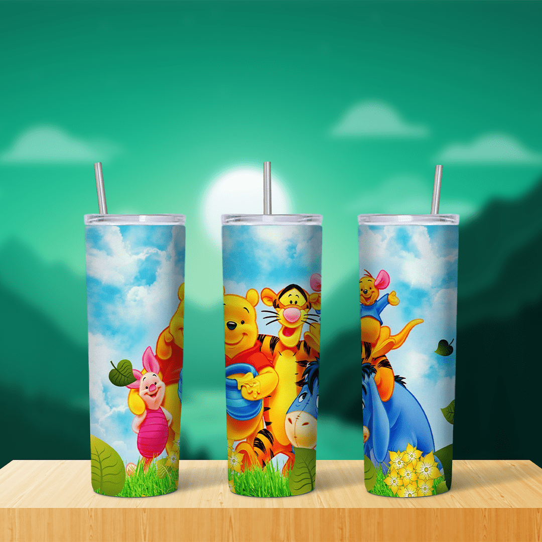 A 20 oz skinny tumbler wrap with Pooh and his honey pot, Tigger, Piglet, Eeyore and Roo on green grass with yellow flowers under. Sublimation design