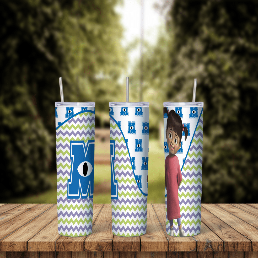 A full 20 oz skinny tumbler wrap with the Monsters Inc M logo on a purple and green chevron pattern, and Boo in her pink shirt. Sublimation design