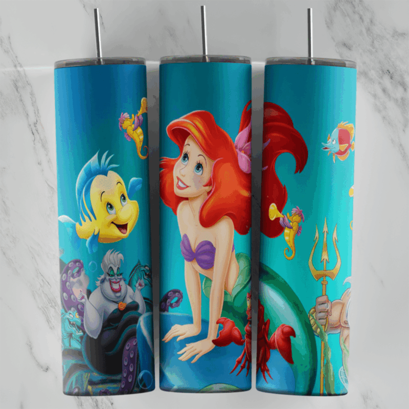A 20 oz skinny tumbler wrap with Ariel leaning on a rock in the center, Flounder and Sebastian on one side and Ursula. Sublimation design