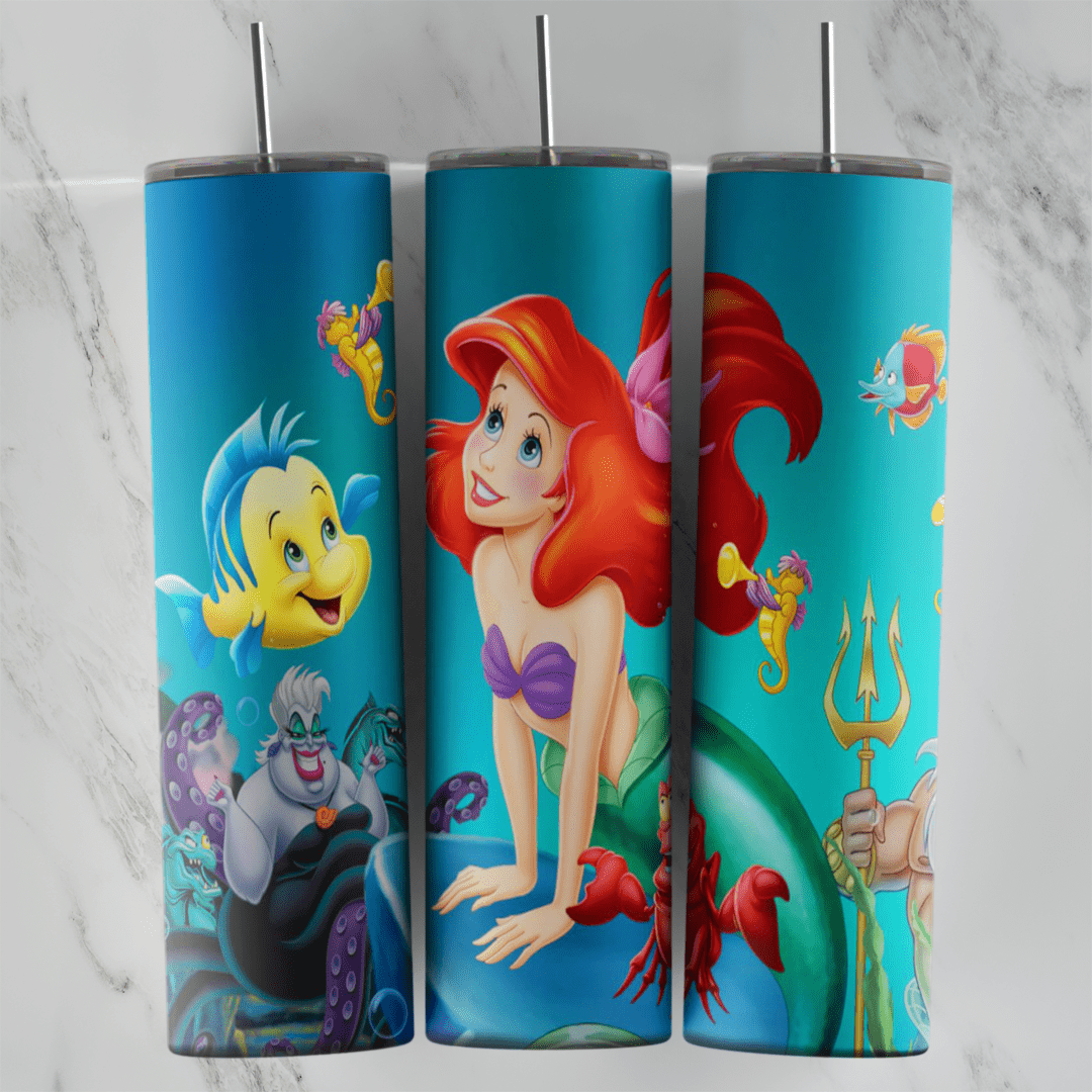 A 20 oz skinny tumbler wrap with Ariel leaning on a rock in the center, Flounder and Sebastian on one side and Ursula. Sublimation design