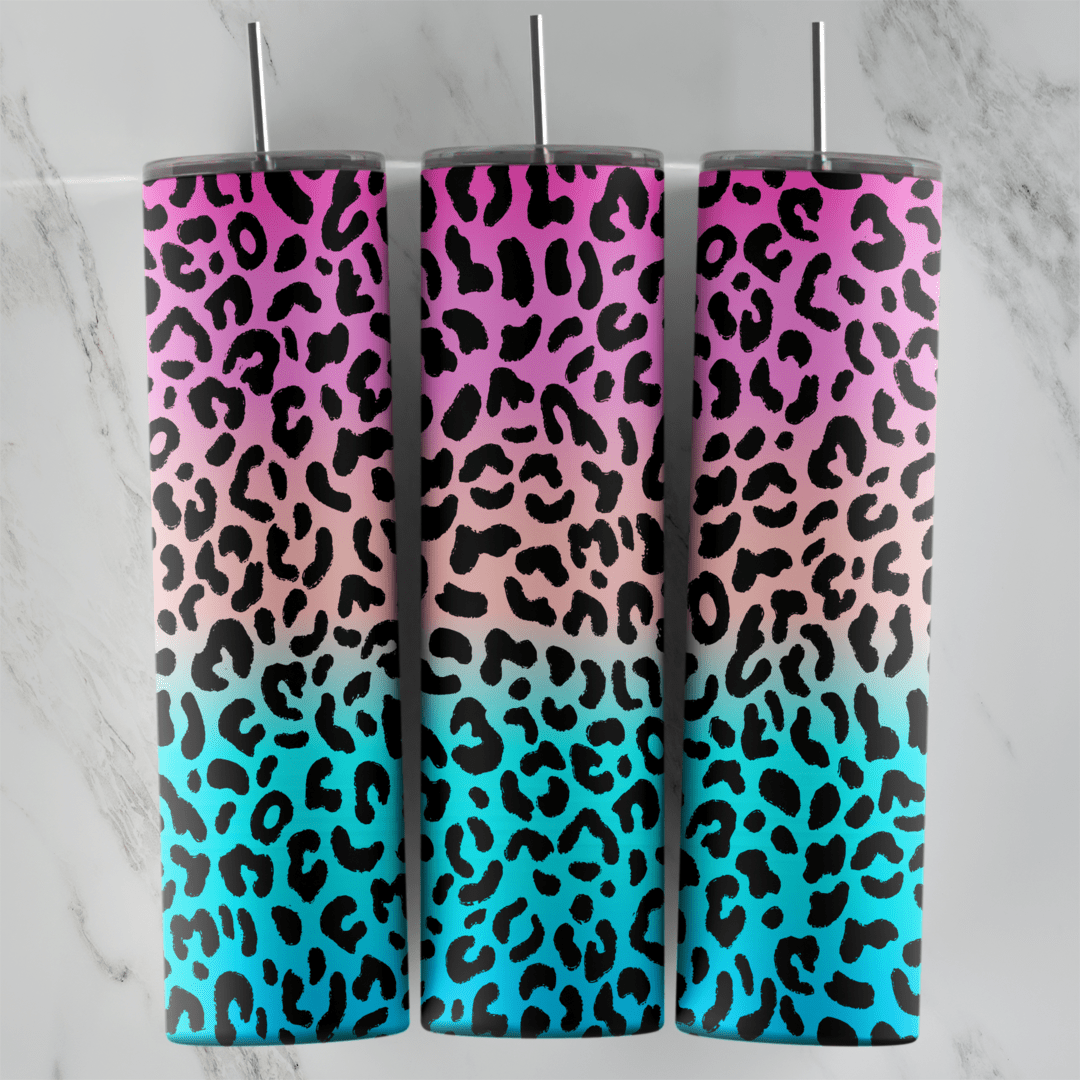 A leopard print tumbler wrap with black spots over an ombre that fades from pink at the top to turquoise at the bottom. Sublimation design