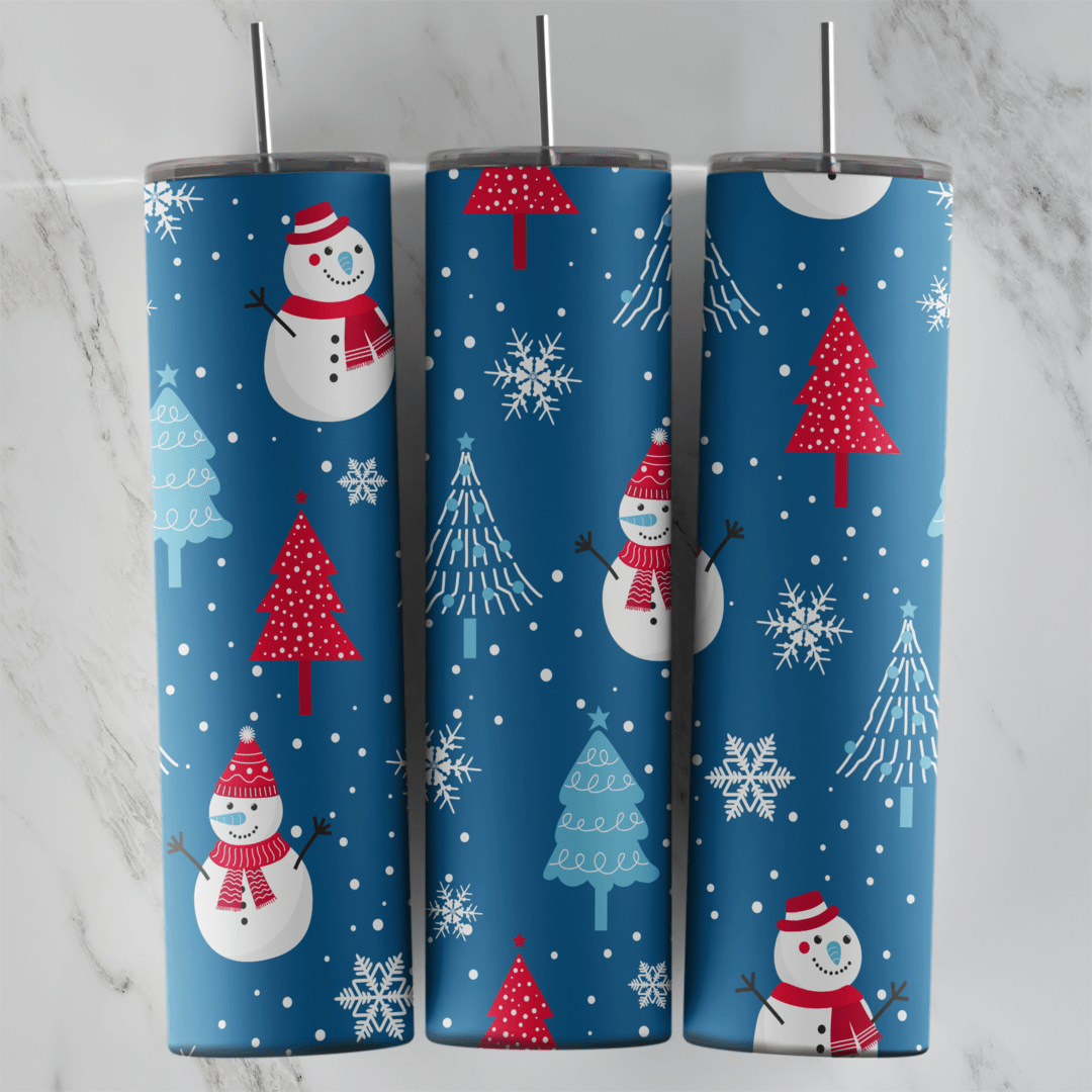 A full 20 oz skinny tumbler wrap on navy blue with snowmen, red and white Christmas trees and falling snowflakes. Sublimation design