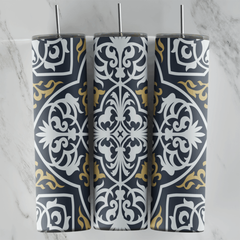 A 20 oz skinny tumbler wrap with a charcoal gray arabesque tile pattern: large white medallions with gold scroll accents. Sublimation design
