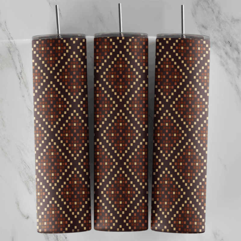 A 20 oz skinny tumbler wrap with a brown dotted diamond lattice pattern in cream and rust stitches on a dark brown background. Sublimation design