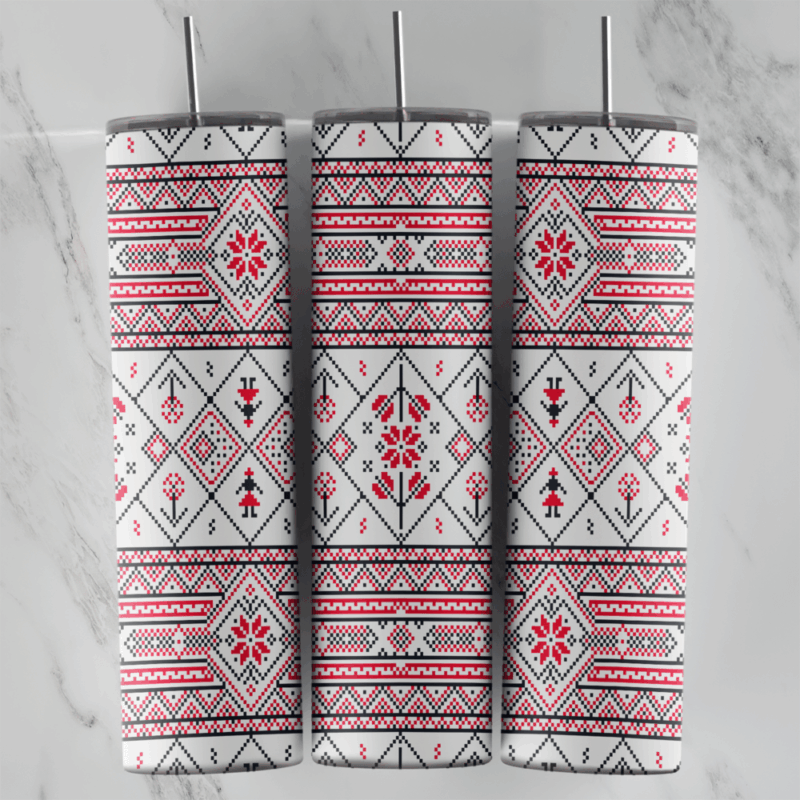 A 20 oz skinny tumbler wrap with a Slavic style folk cross-stitch pattern: red and black flower borders and diamond medallions. Sublimation design