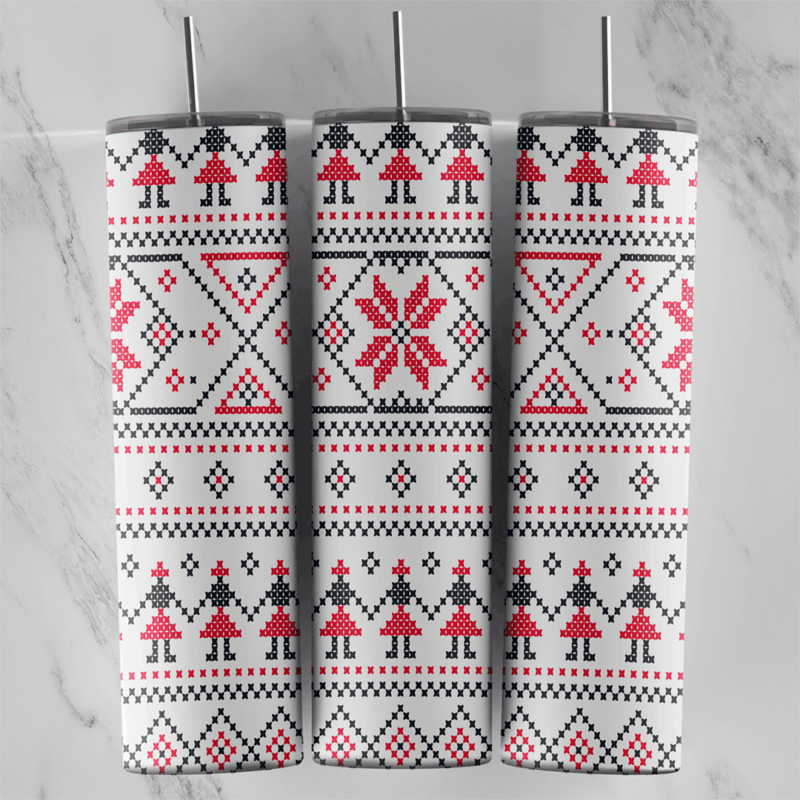 A 20 oz skinny tumbler wrap with a white Nordic cross-stitch pattern: red snowflake stars, small stitched figures and black. Sublimation design