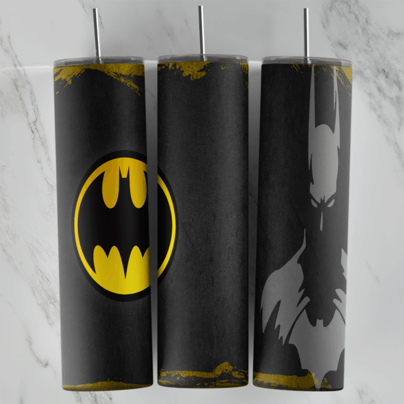 A black 20 oz tumbler wrap with gold grunge edges, a large yellow Batman bat logo in an oval and a gray shadow figure of Batman. Sublimation design