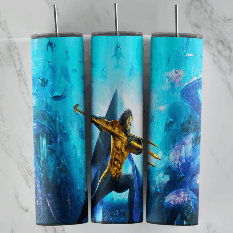 A full 20 oz skinny tumbler wrap of Aquaman with a trident in a deep blue ocean, surrounded by fish and underwater structures. Sublimation design