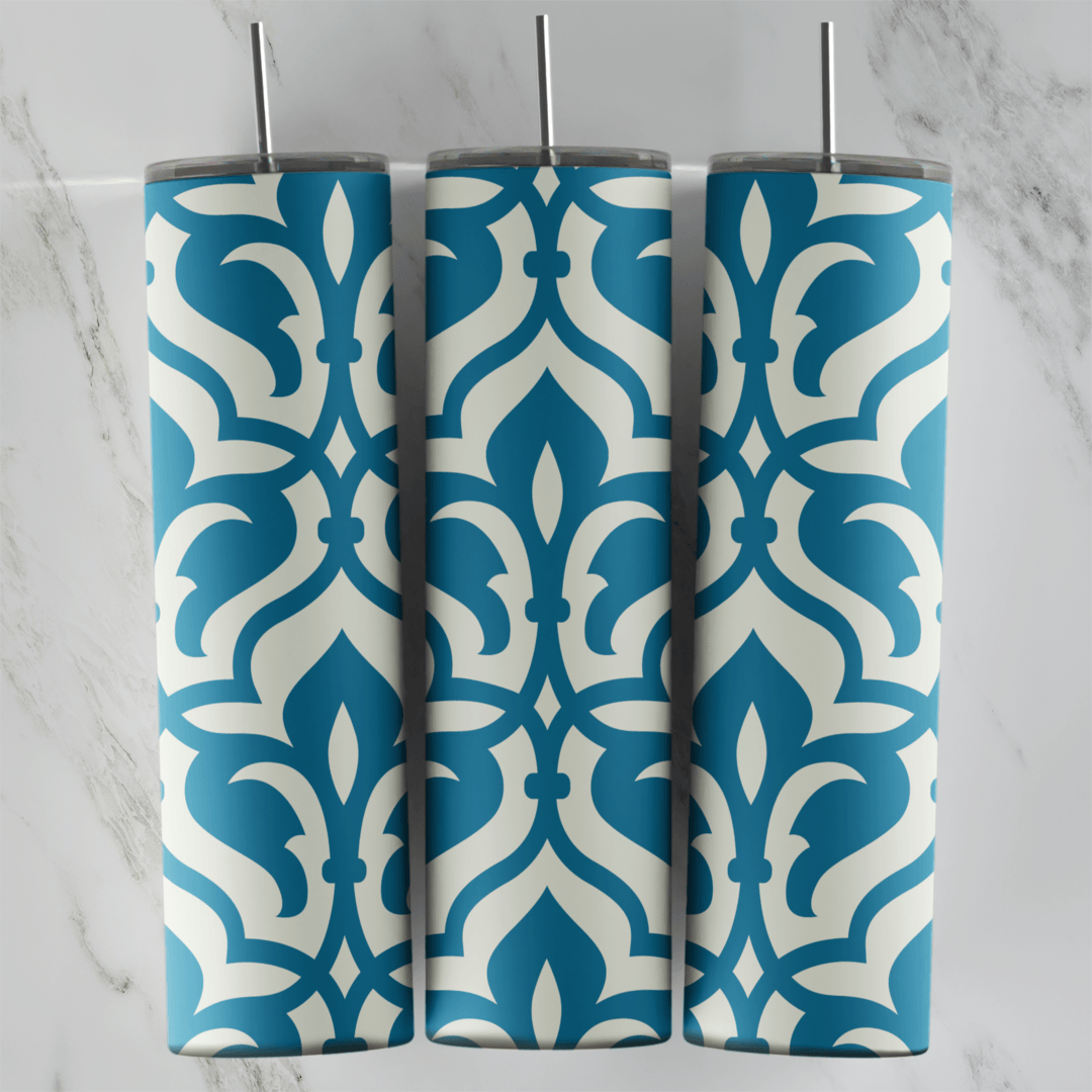 A 20 oz skinny tumbler wrap with a teal and cream arabesque pattern: bold interlocking ogee shapes and fleur motifs repeating all. Sublimation design