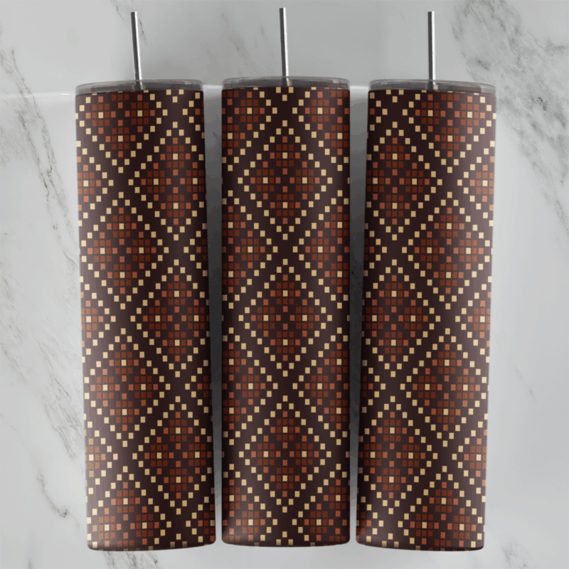 A 20 oz skinny tumbler wrap with a rust and cream dotted diamond lattice pattern stitched on a deep brown background. Sublimation design