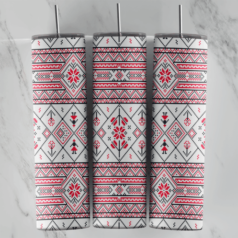 A 20 oz skinny tumbler wrap with a white folk embroidery pattern: red and black cross-stitch borders, diamonds and stylized. Sublimation design