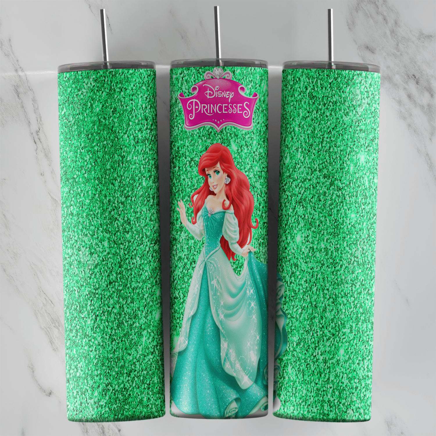A 20 oz skinny tumbler wrap with Ariel in a green gown and the Disney Princesses logo on green glitter. Sublimation design