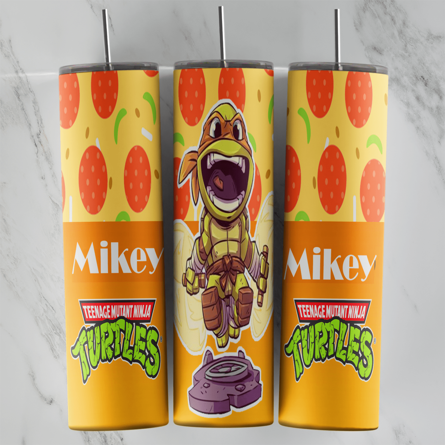 A 20 oz skinny tumbler wrap with a chibi Michelangelo shouting, Mikey lettering and the Teenage Mutant Ninja Turtles logo. Sublimation design