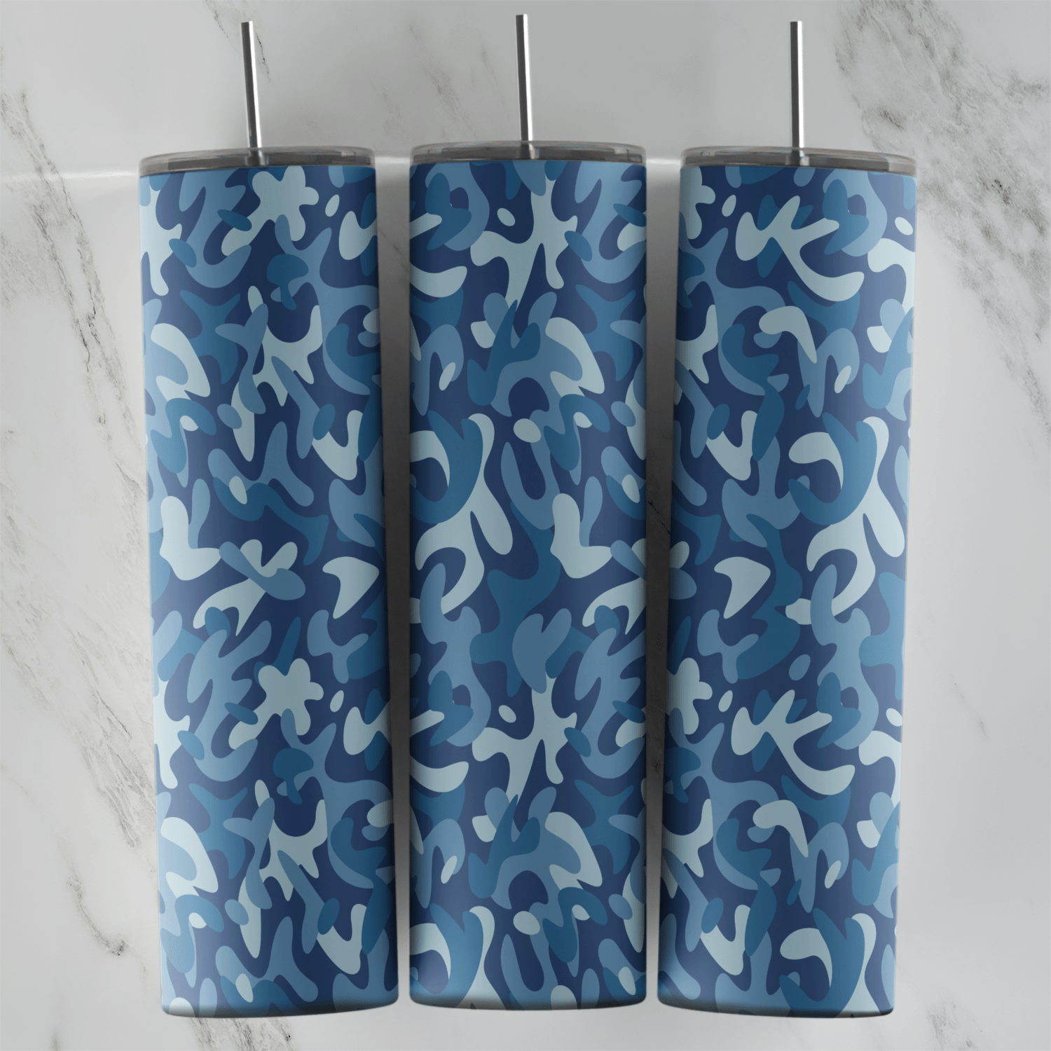 A blue camo tumbler wrap with a swirling pattern of navy, steel blue and light blue shapes in a dense, even camouflage. Sublimation design