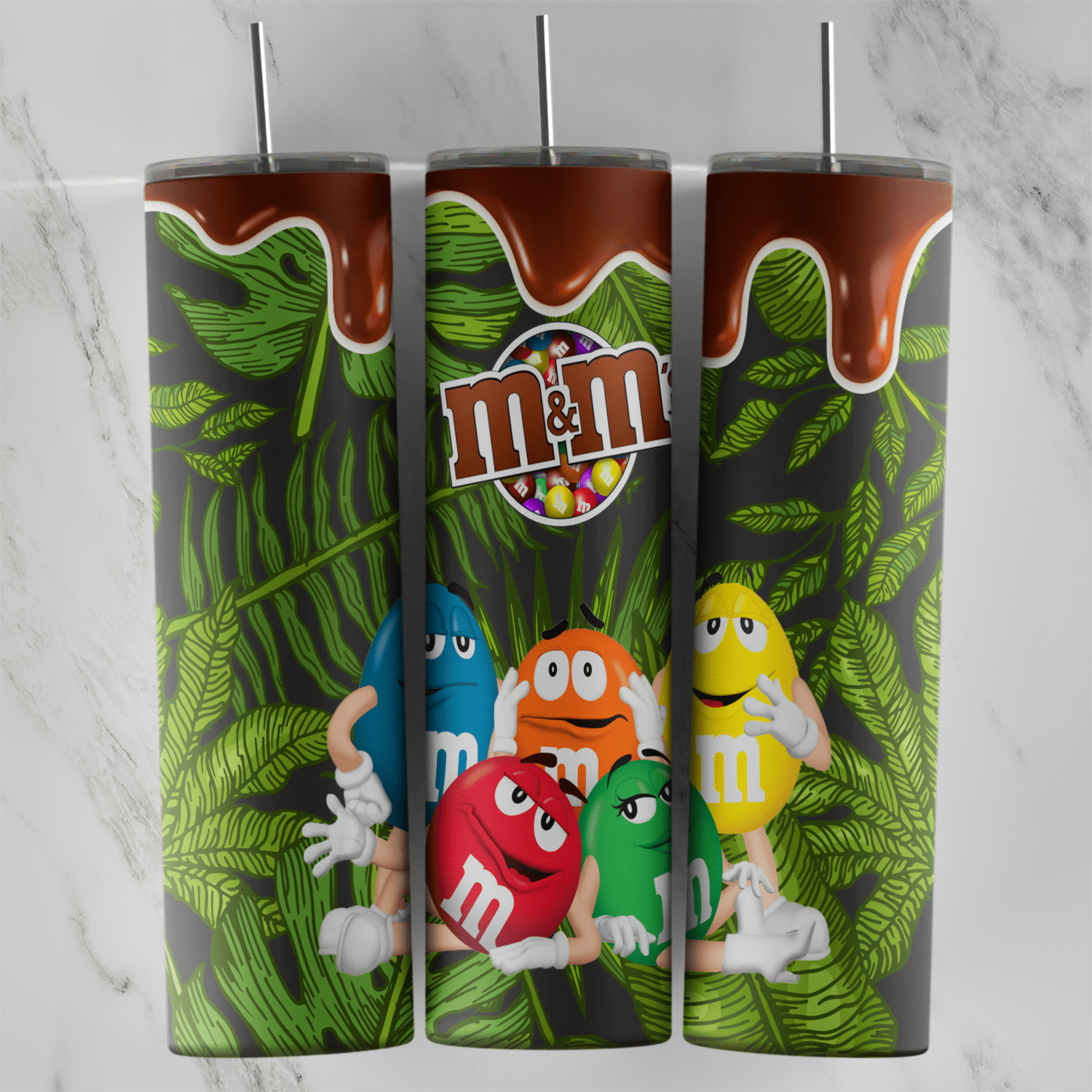 A dark tropical M and M tumbler wrap with green palm and monstera leaves, a chocolate drip border, the logo and the candy. Sublimation design