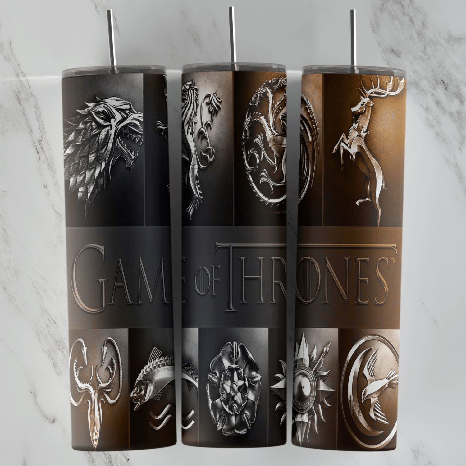 A 20 oz skinny tumbler wrap with metallic house sigils on brown and black panels, including a direwolf, a dragon and a lion. Sublimation design