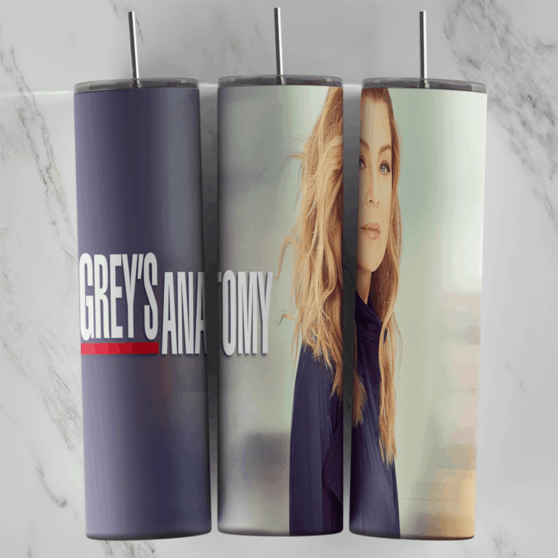 A Grey’s Anatomy tumbler wrap with Meredith’s portrait in soft pastel light and the Grey’s Anatomy title lettering on a blurred. Sublimation design